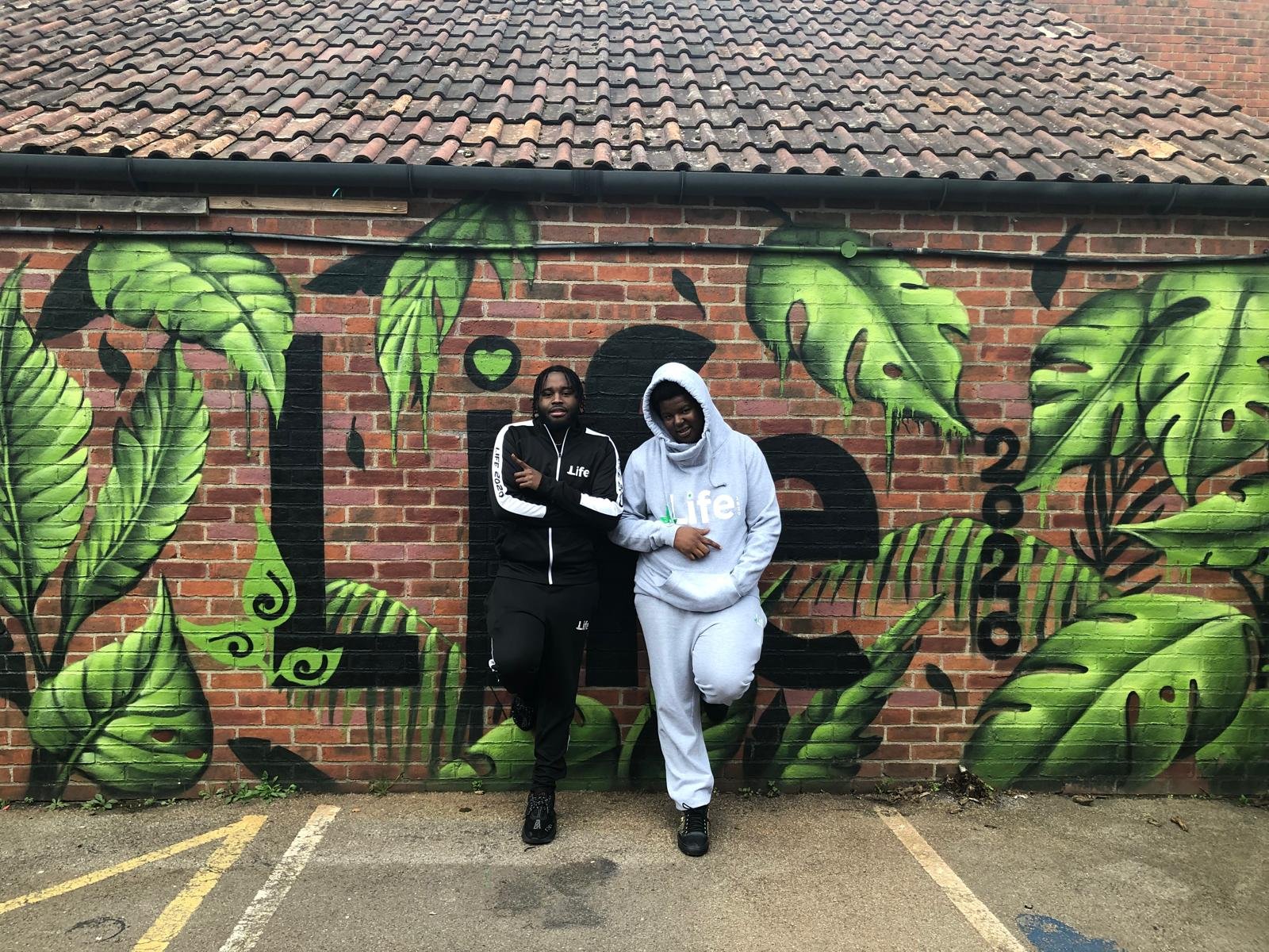 Life2020 Pathways team in front of the Life2020 mural